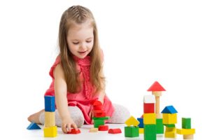 kid girl playing with block toys