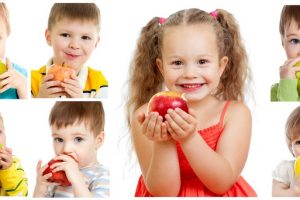 collection of babies and kids eating apples, isolated on white